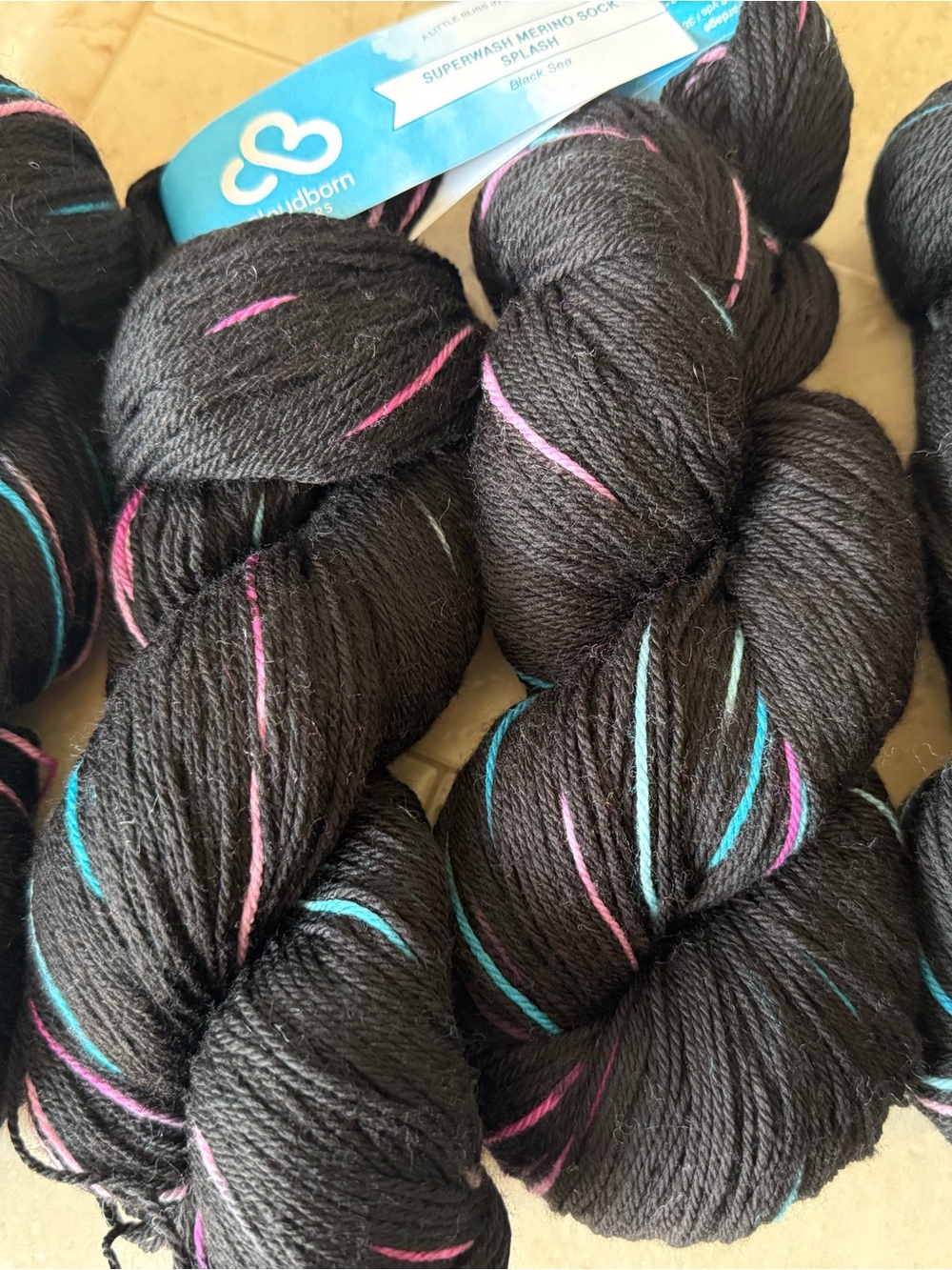 Cloudborn Fibers Superwash Merino Yarn - Black with Pink & Teal Flashes